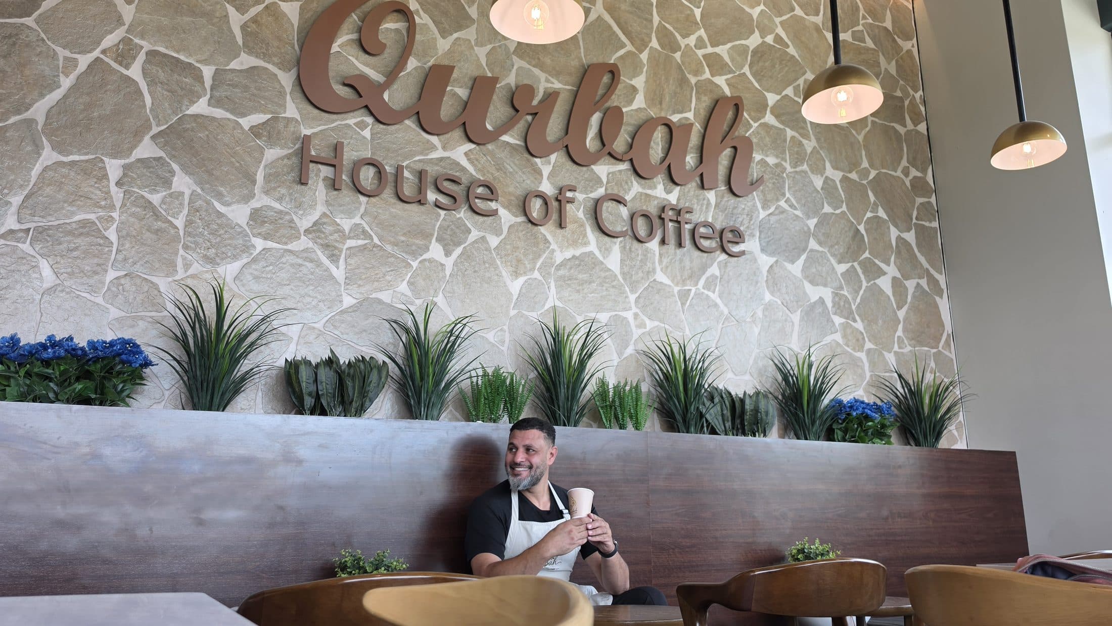 Neal beneath the signage wall